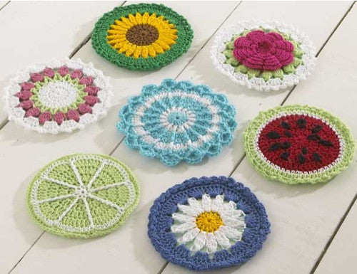 Stack of round colorful crochet coasters